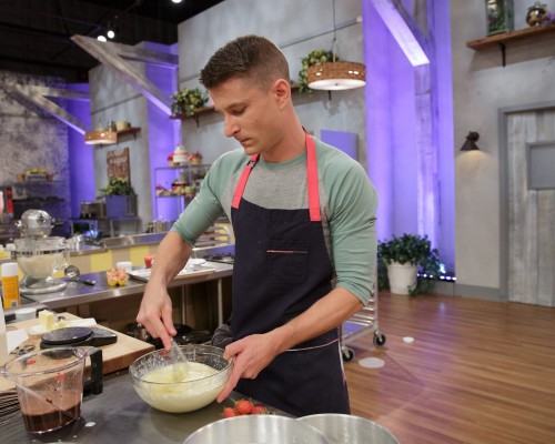 Contestant Dan Langan mixes ingredients for a neopolitan cake during the "Berry Naked Cake" main-heat challenge, as seen on Food Network's Spring Baking Championship, Season 2.